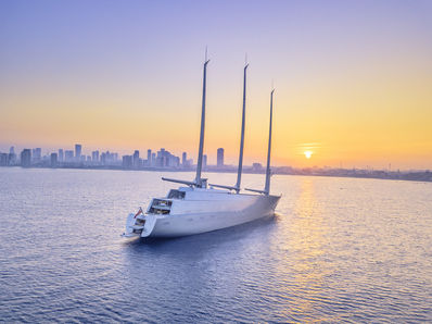 White boat at sea during sunset