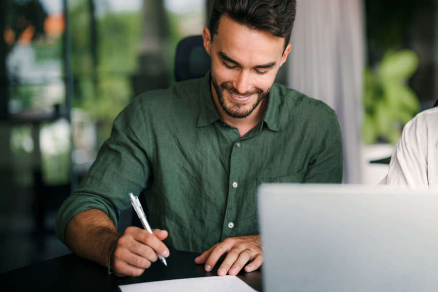 A maritime Engineer signing his contract to work abroad in The Netherlands or Germany, working on shipbuilding, yacht building or offshore.